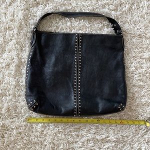 Michael Kors purse handbag, black with silver studs and white stitching